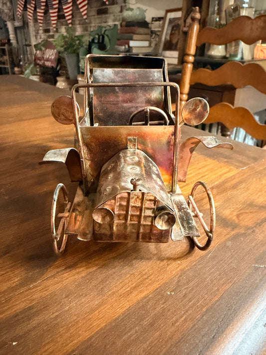 Vintage copper and tin metal antique car music box