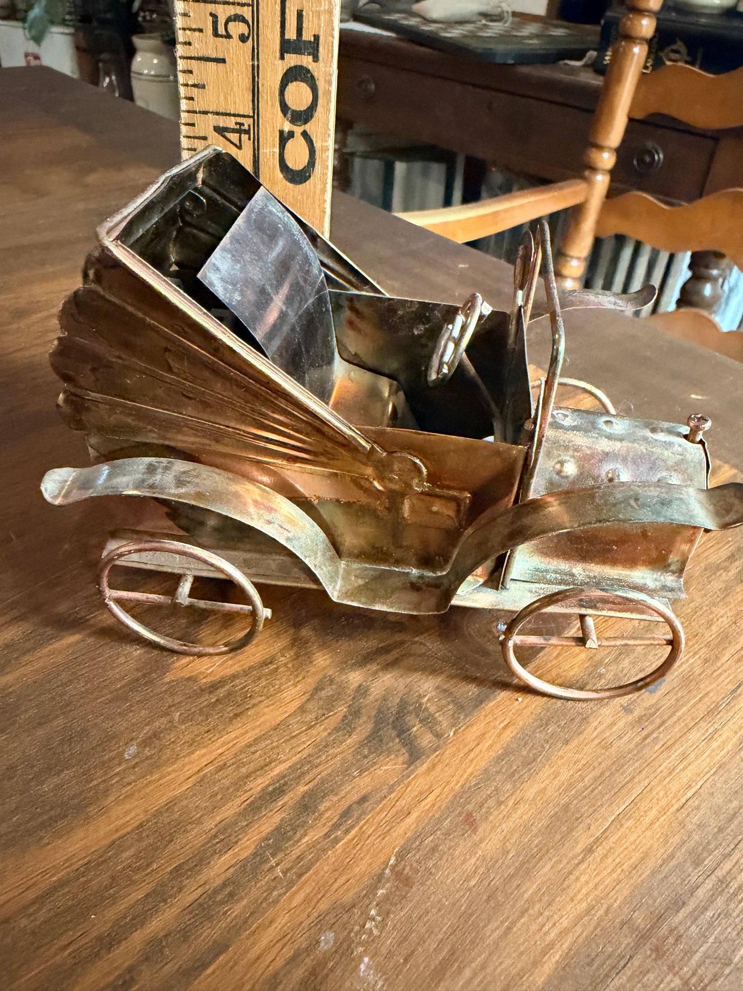 Vintage copper and tin metal antique car music box